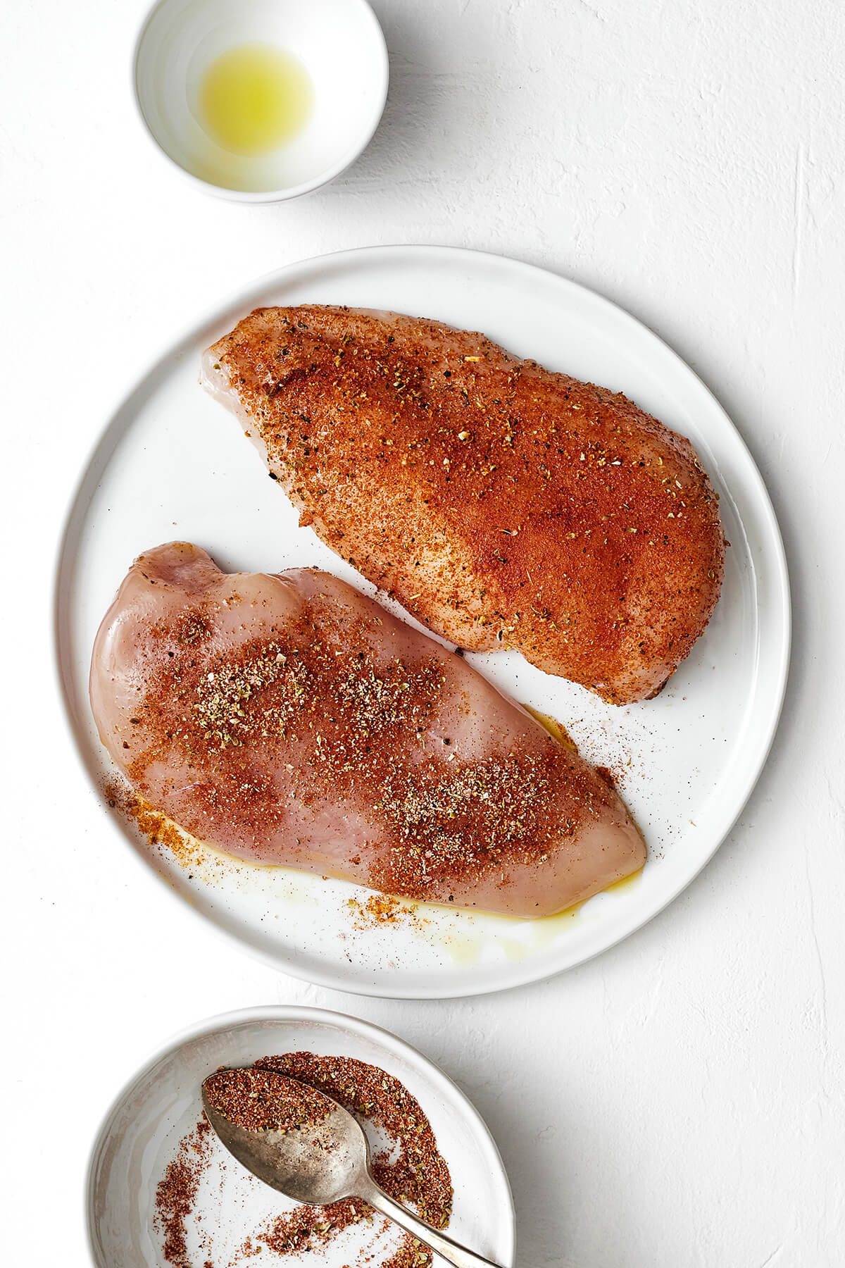 Seasoning chicken breasts before adding to air fryer