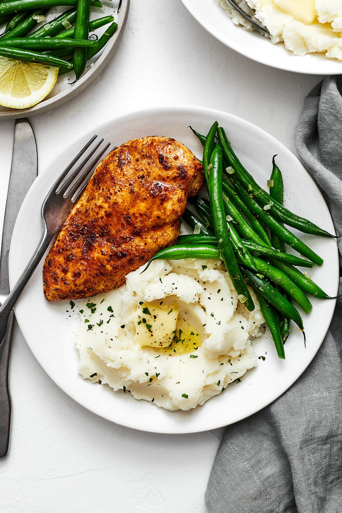 A plate with air fryer chicken breasts and mashed potatoes
