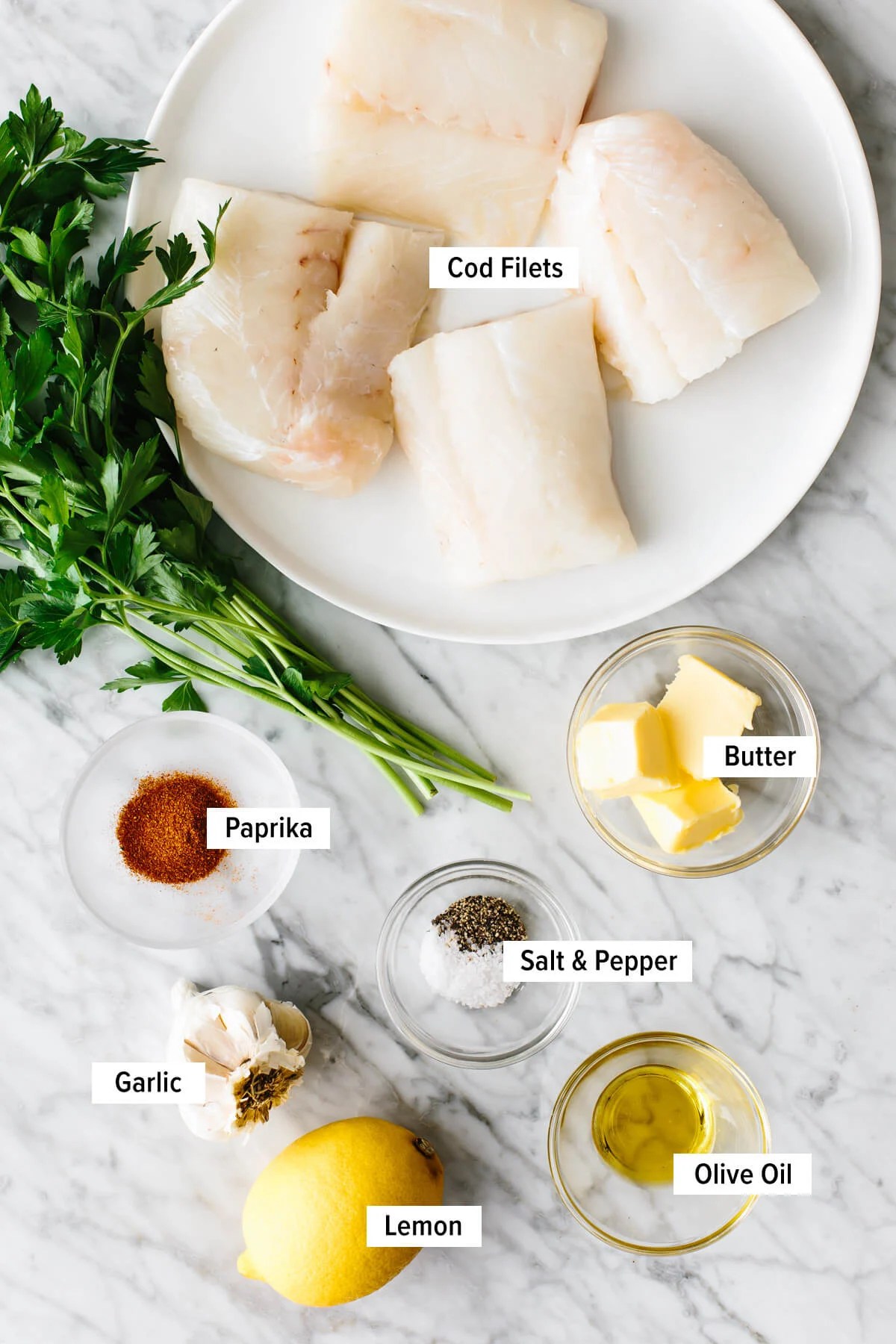 Ingredients for baked cod on a counter.