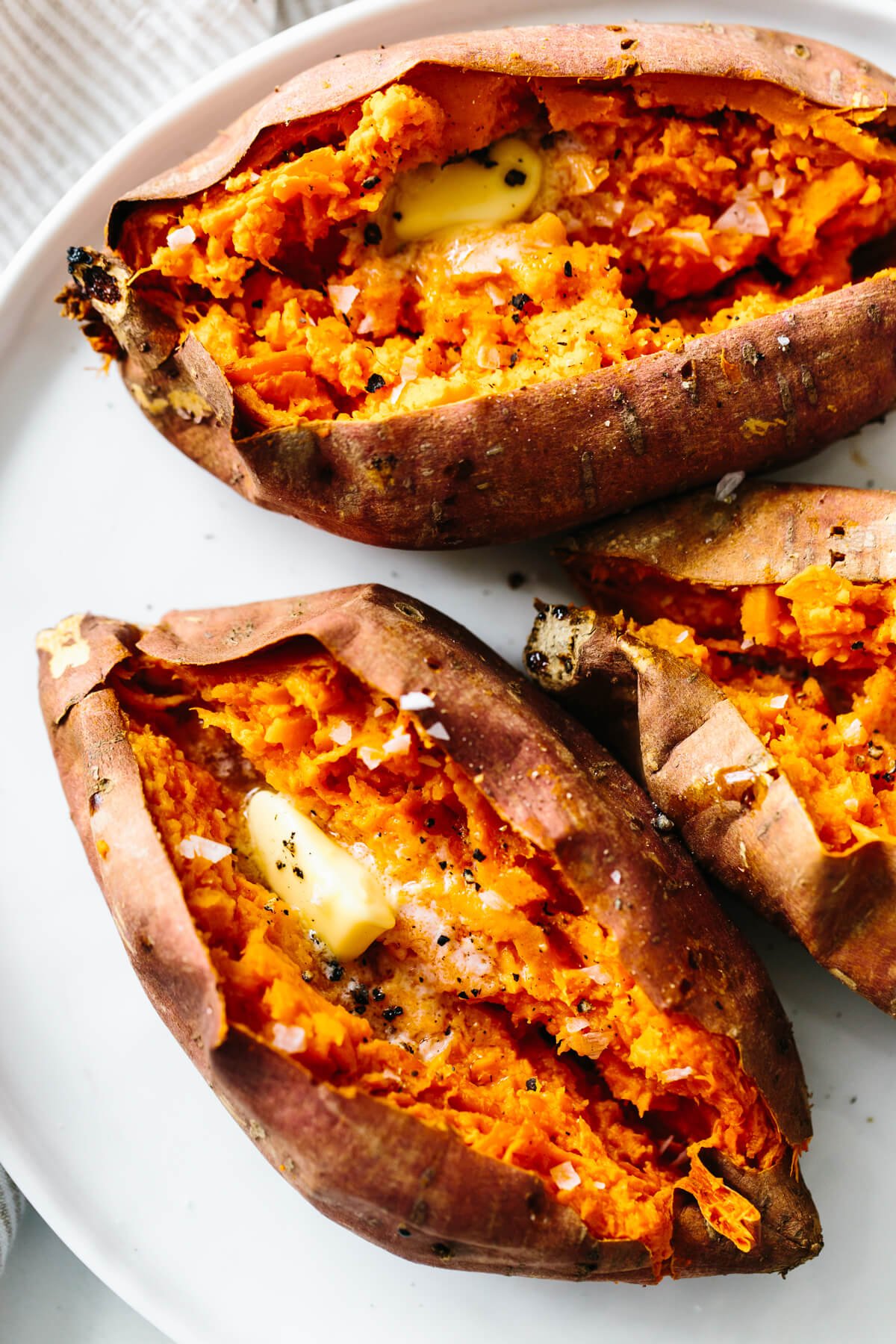 Baked sweet potato is a healthy side dish or main meal. Learn how to bake sweet potatoes in the oven perfectly.