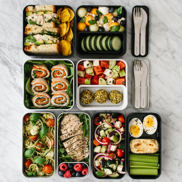 Bento box lunches lined up together on a table