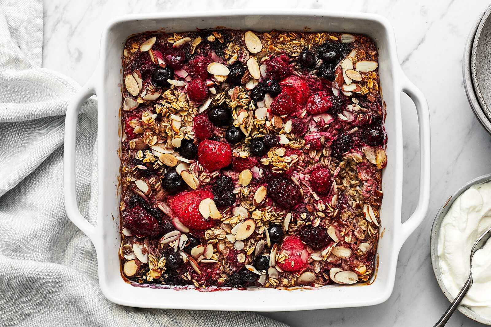 A baking dish with berry baked oatmeal