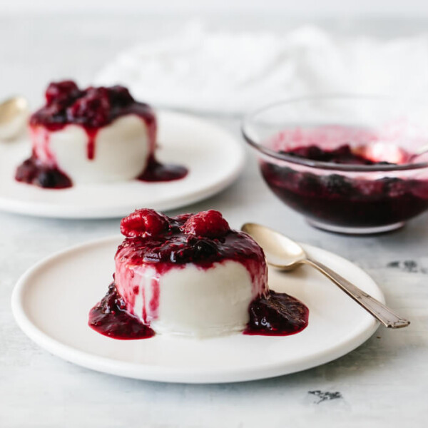 A creamy, dairy-free, coconut panna cotta that's topped with slightly boozy macerated berries. A delicious dessert recipe!