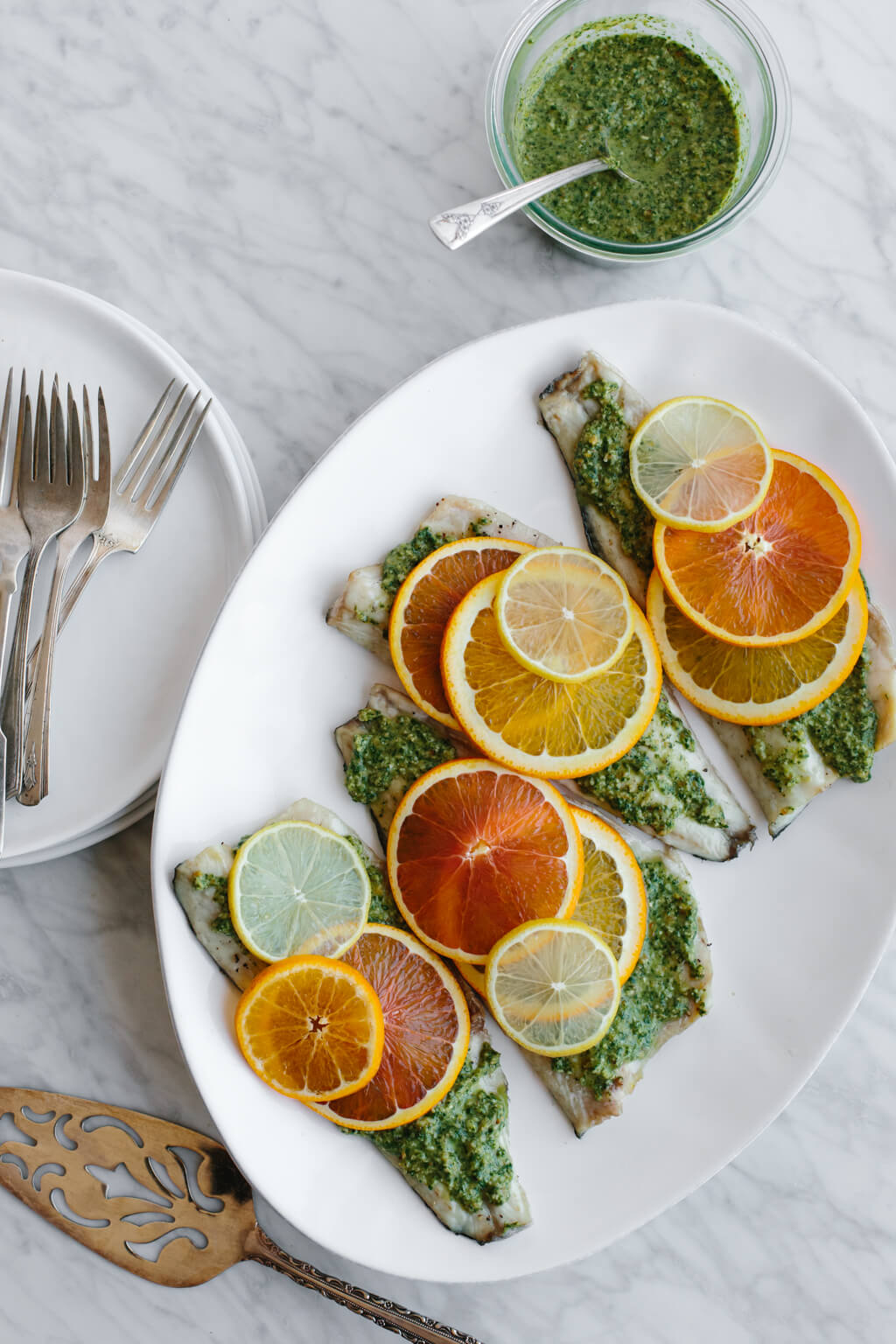 This roasted branzino with citrus pesto recipe is light, bright and extremely flavorful. It's sure to be your favorite fish recipe.