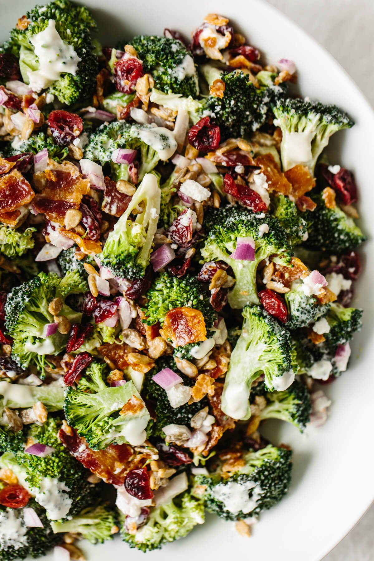 A close up of broccoli salad in a bowl