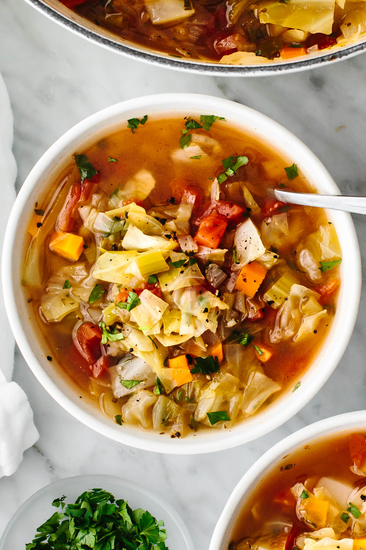 Cabbage soup in a bowl on a table.
