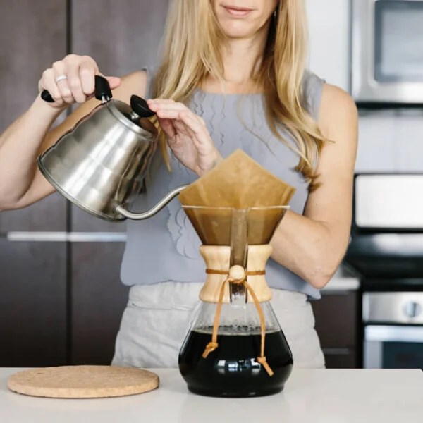 Learn how to brew coffee in a Chemex Coffee Maker! Here's step-by-step instructions along with a tutorial video and tips on filters and how to clean your Chemex.