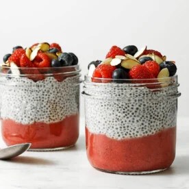 Jars of chia pudding with a spoon