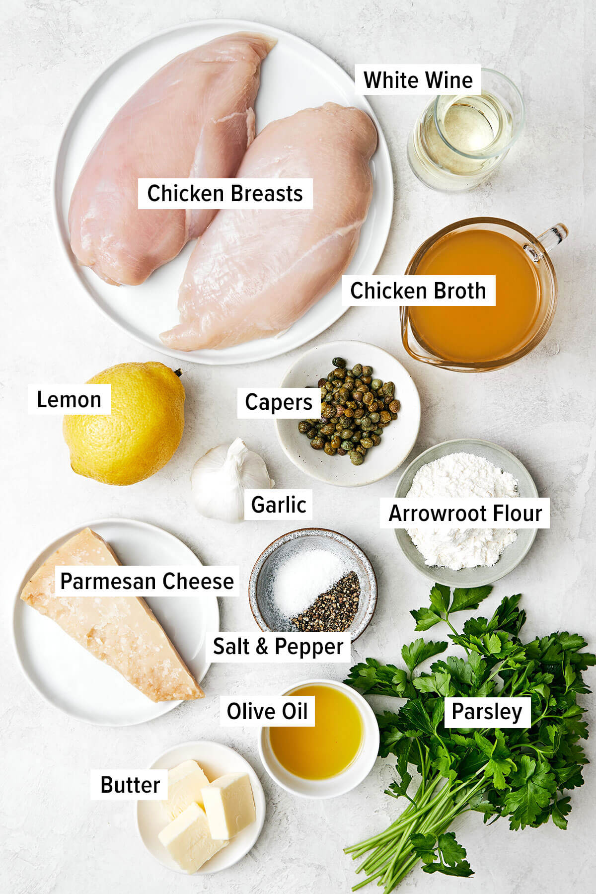 Ingredients for chicken piccata on a table