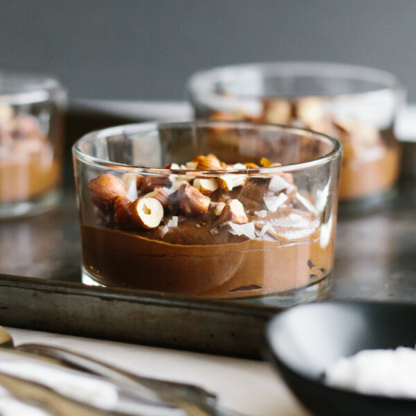 Chocolate avocado pudding topped with hazelnuts and sea salt.