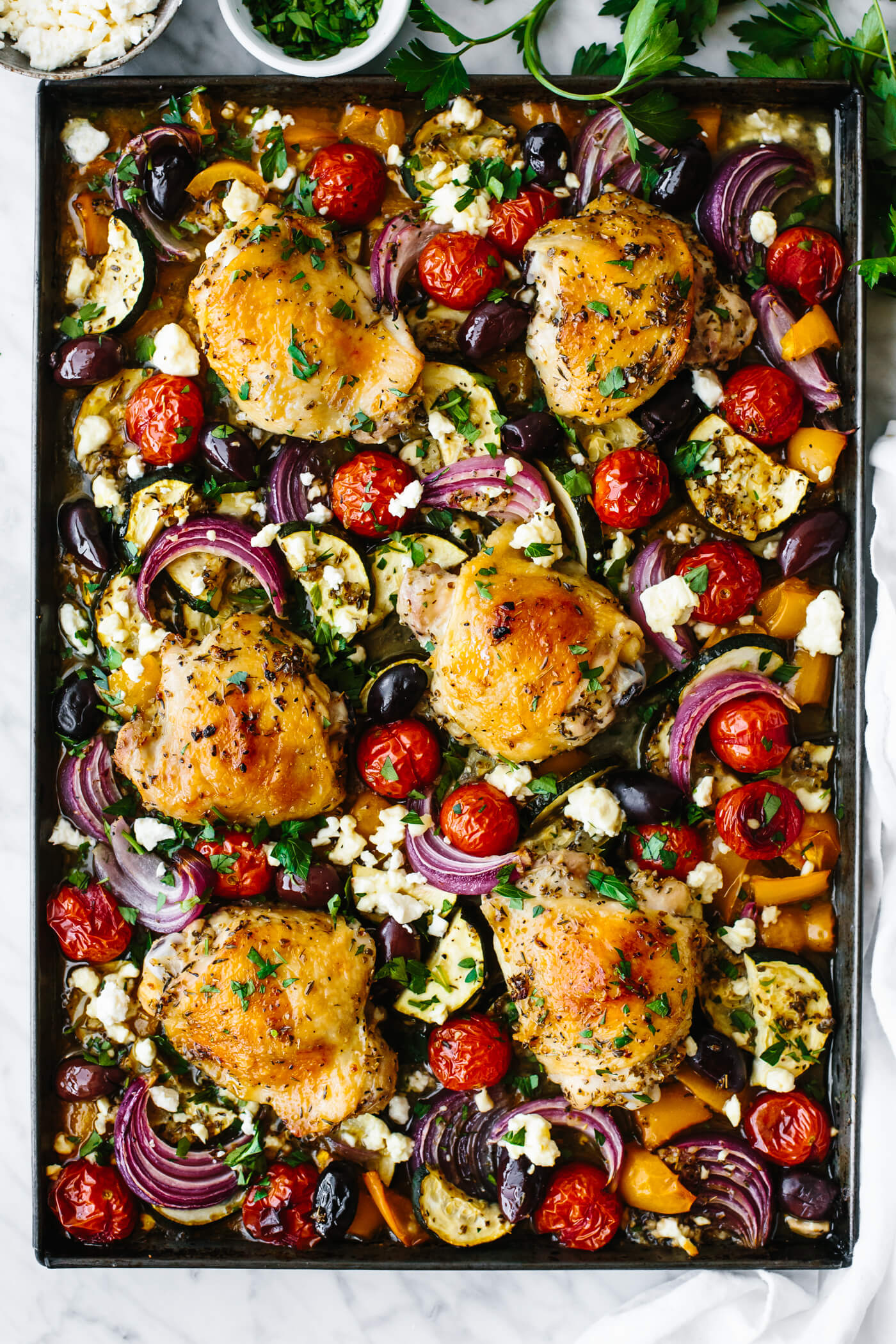 Greek sheet pan chicken with vegetables.