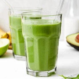 A glass of a green smoothie.