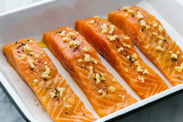 A pan with baked salmon fillets.