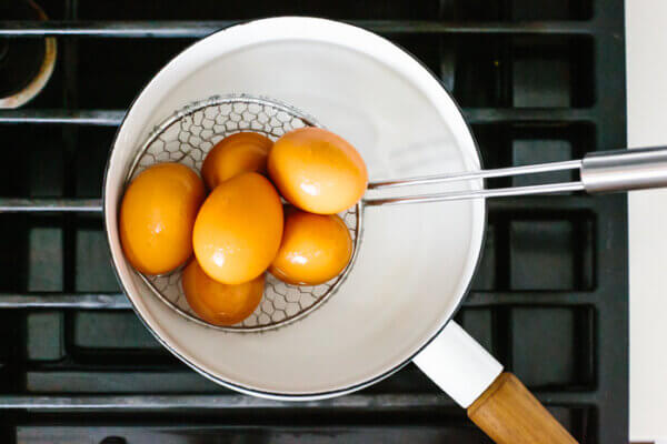 Placing eggs in boiling water
