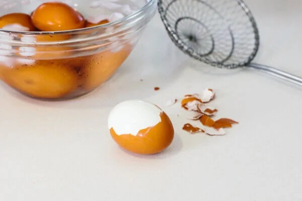 Boiled egg peeled on a counter