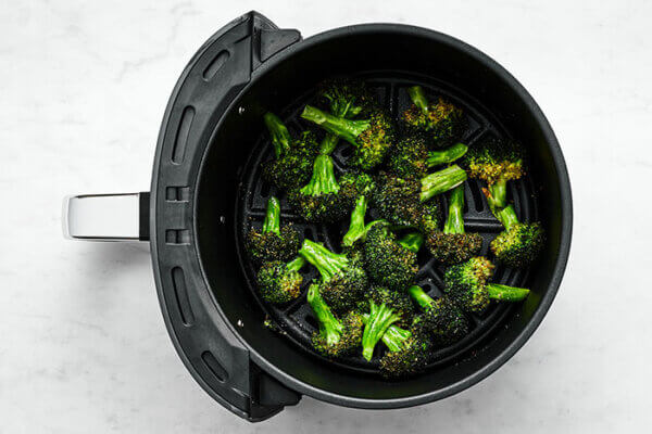 Air fryer broccoli in air fryer basket