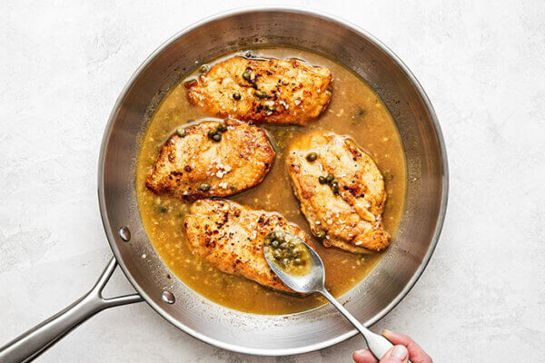 Finished chicken piccata in a pan