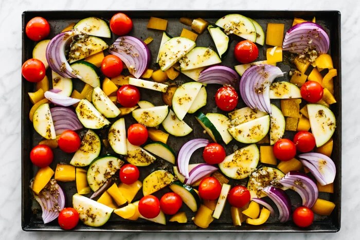 Chopped vegetables on a sheet pan.