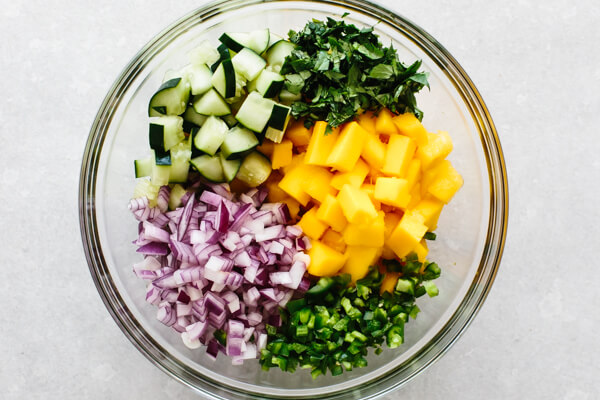 Mango salsa ingredients in a mixing bowl.