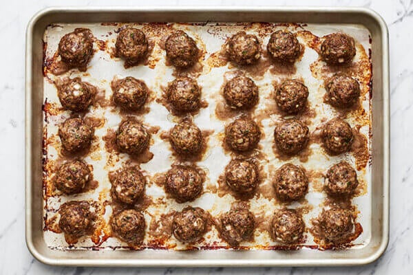 A sheet pan of baked meatballs
