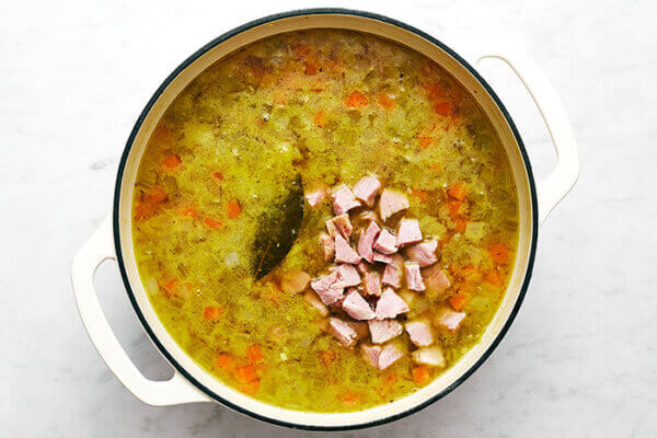 A white pot of split pea soup