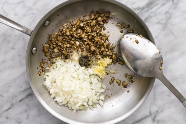 A pan sauteing mushroom filling for stuffed mushrooms