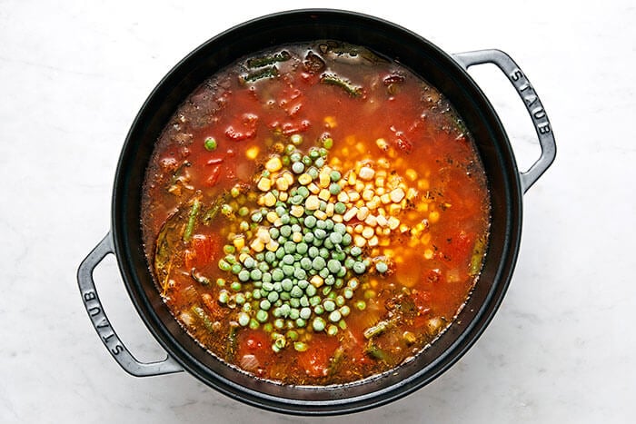 A pot with cooked vegetable soup