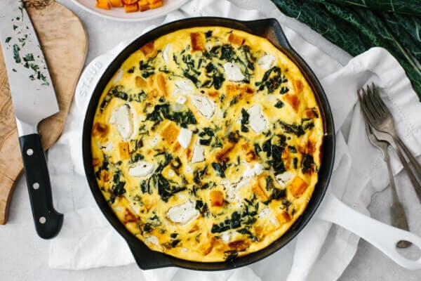 Kale and butternut squash frittata served on a table.