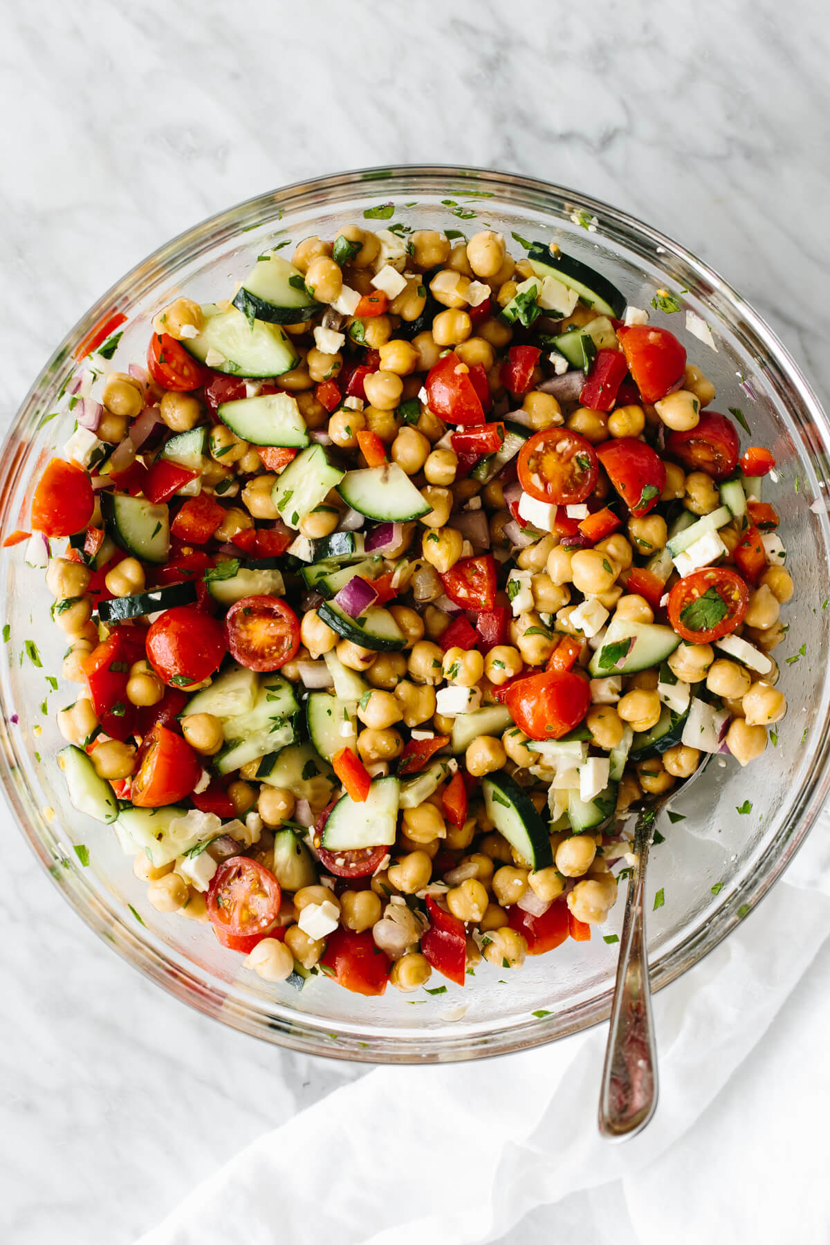 Chickpea salad ingredients mixed in a bowl