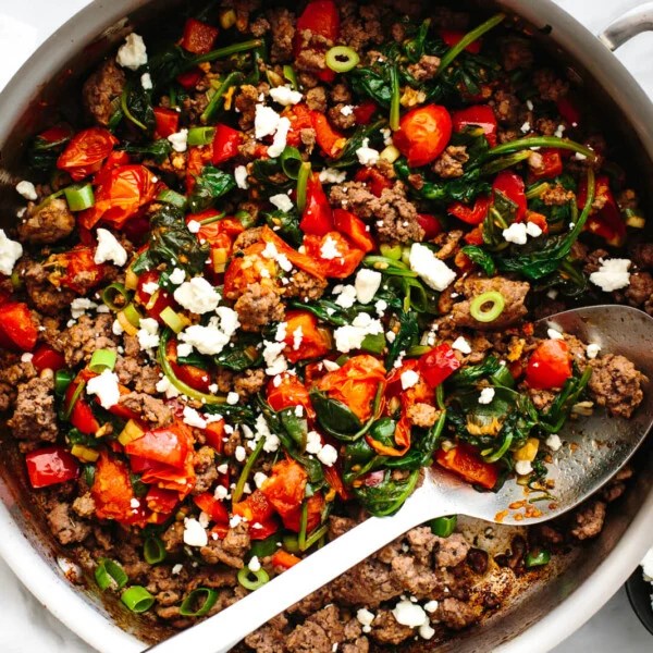 A stainless steel pan with Mediterranean ground beef stir fry