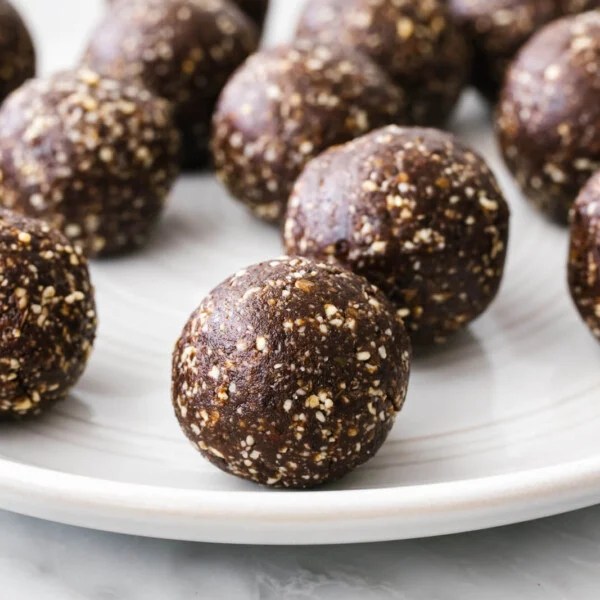 A white plate filled with mint chocolate energy balls