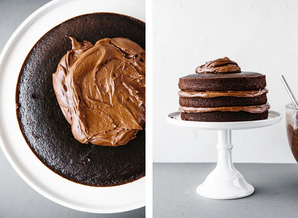 Frosting the chocolate cake with chocolate buttercream frosting.