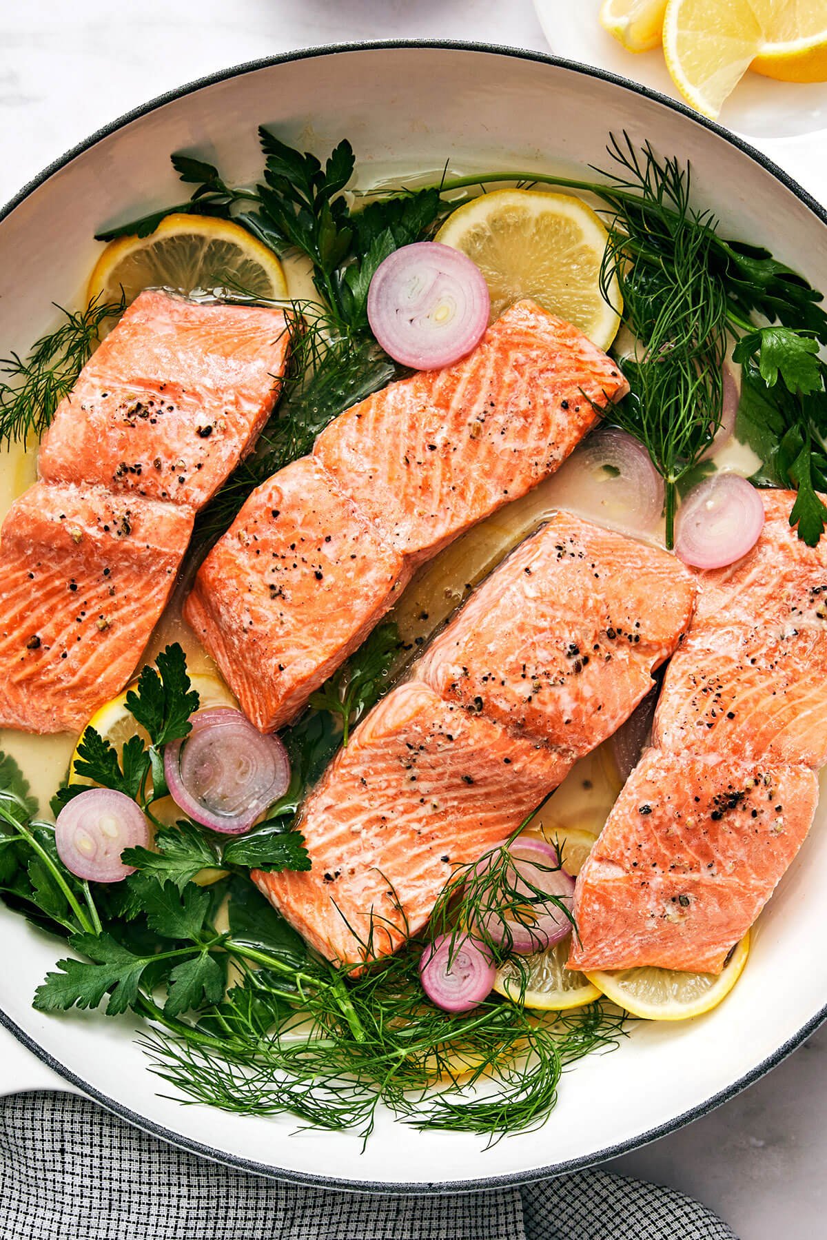Poached salmon in a pan