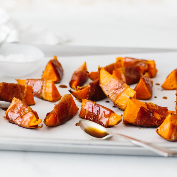 Prosciutto wrapped sweet potatoes drizzled with maple balsamic glaze.