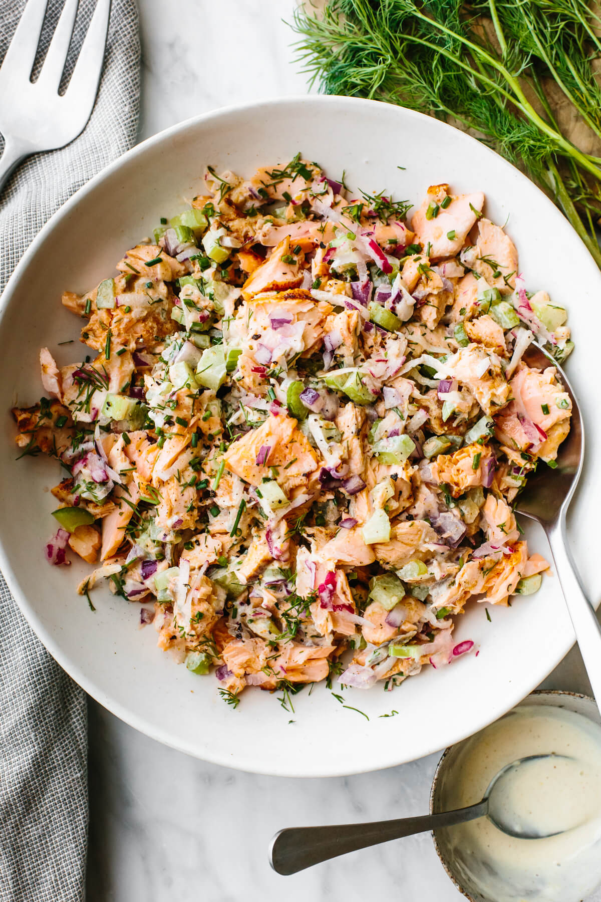 Salmon salad in a large white bowl