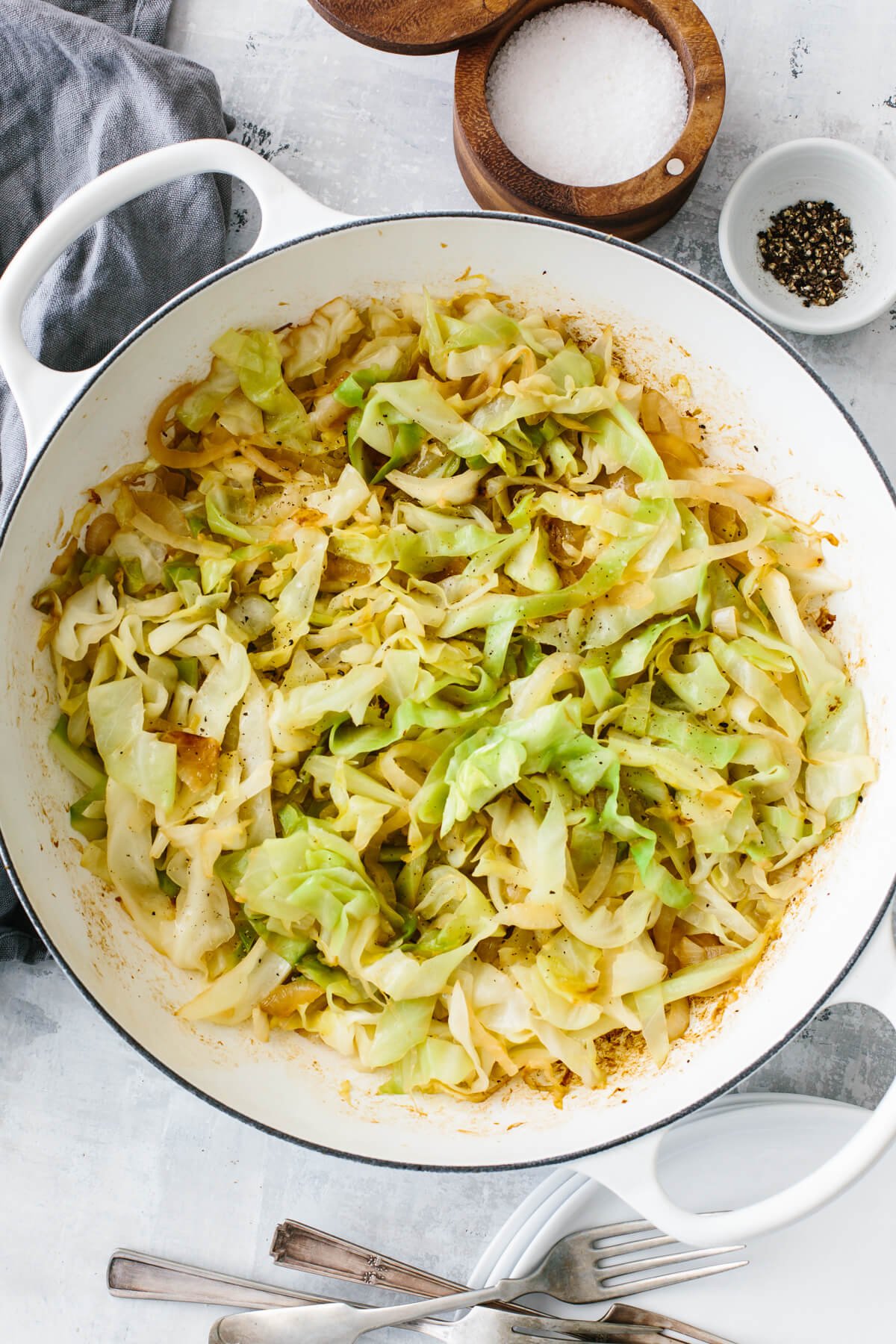 Sauteed cabbage in a pan on a table.