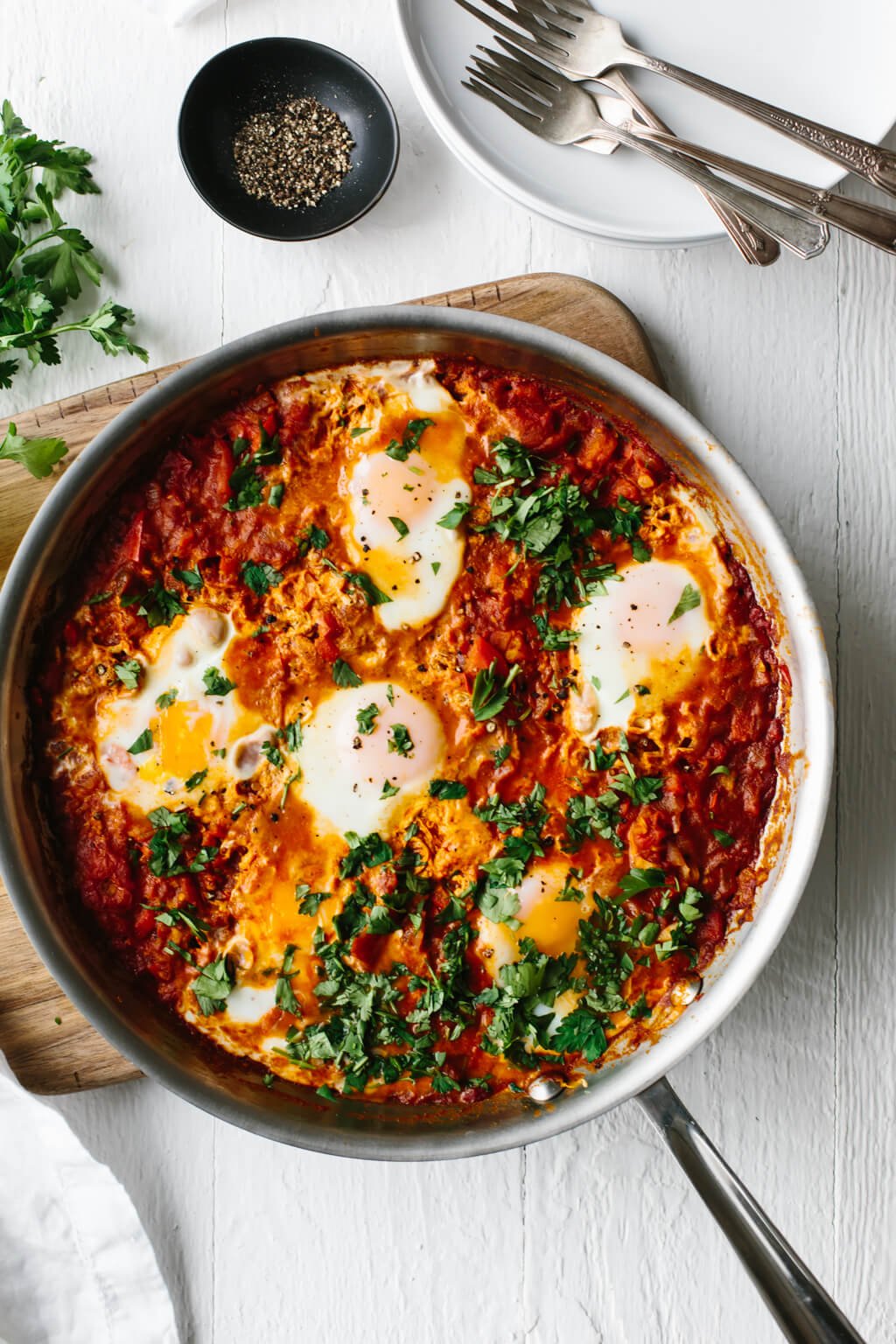 Shakshuka is an easy, healthy breakfast recipe in Israel and other parts of the Middle East and North Africa. It's a simple combination of simmering tomatoes, onions, garlic, spices and gently poached eggs.