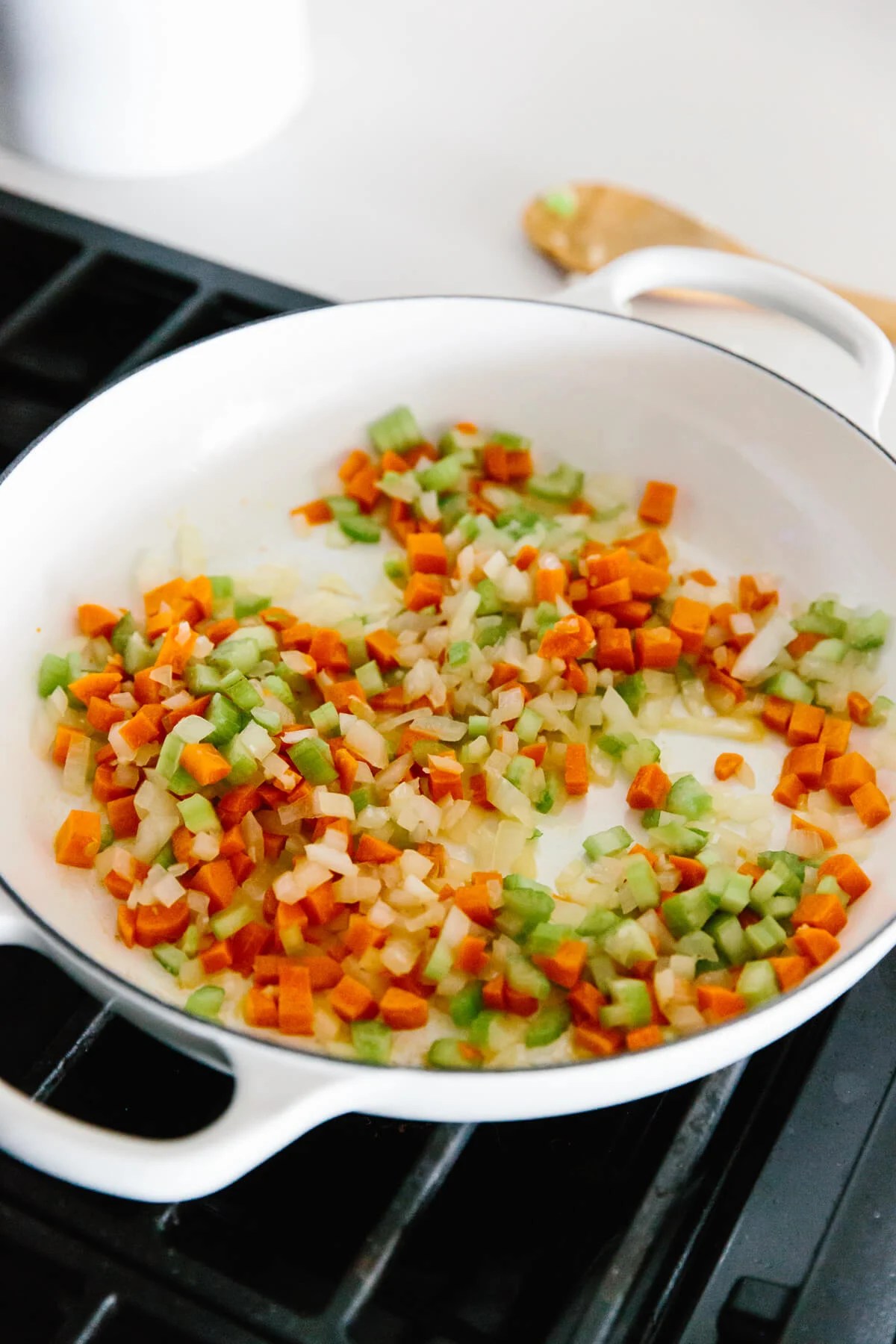 Sauteeing vegetables in a pan for shepherds pie