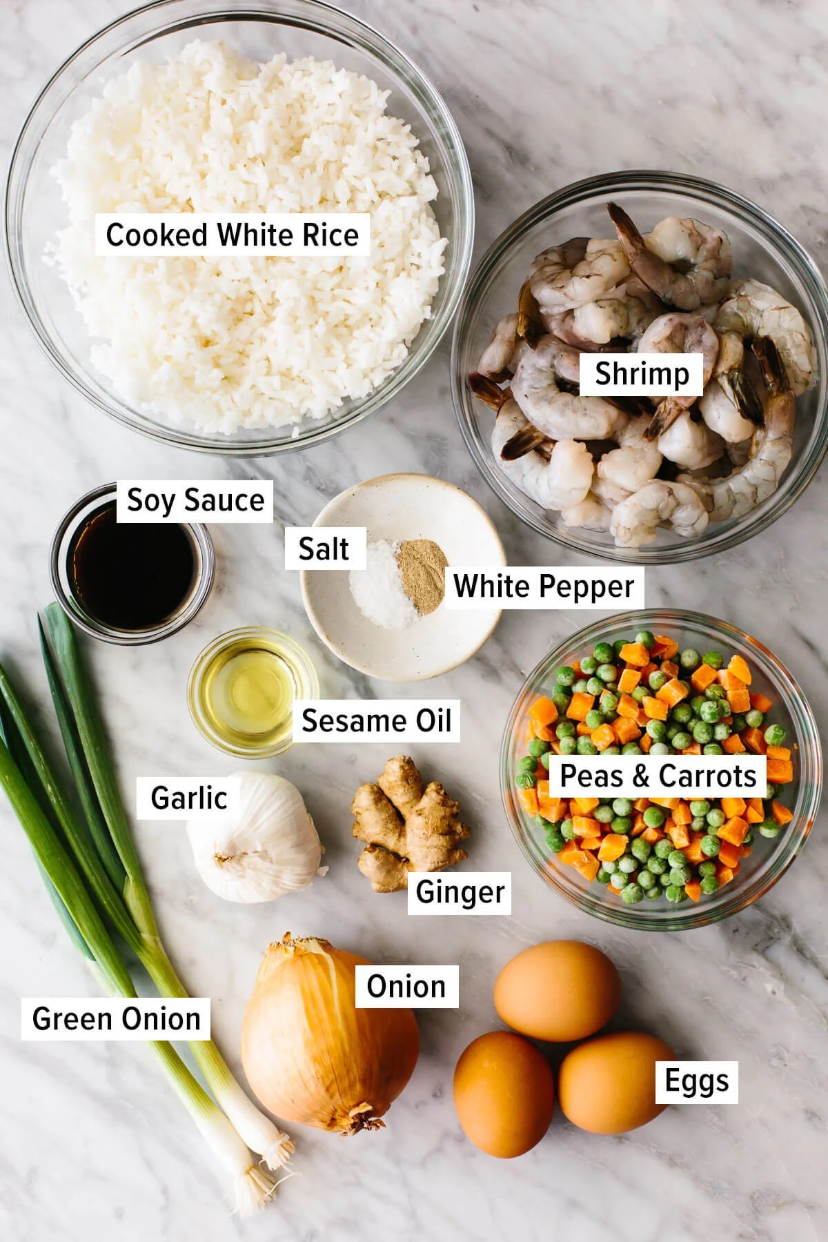Ingredients for shrimp fried rice on a table