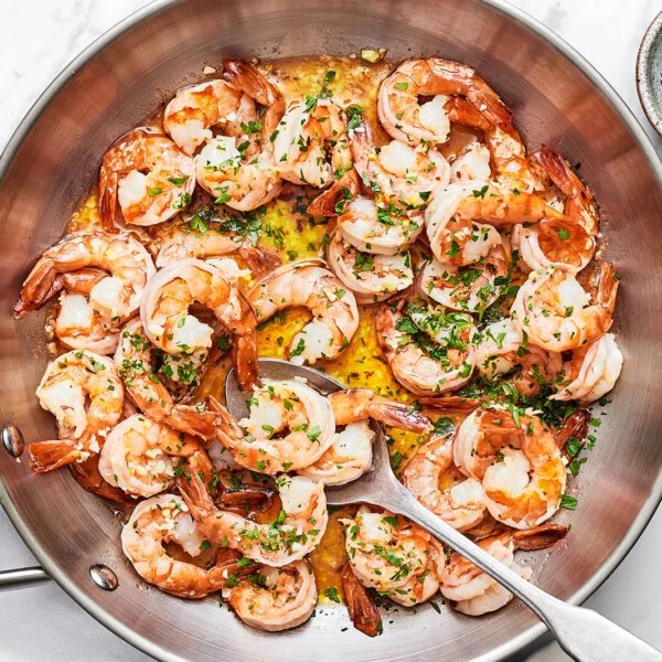 A silver pan of shrimp scampi
