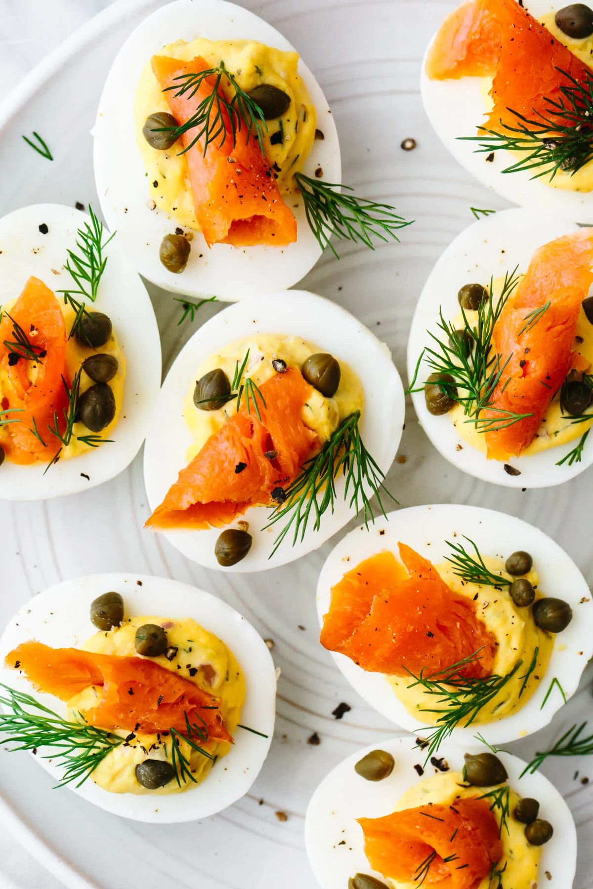 Smoked salmon deviled eggs on a plate.