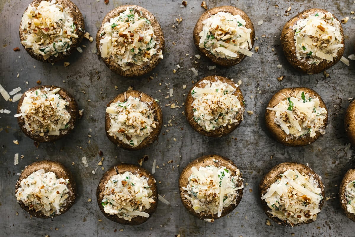 Stuffed mushrooms on a sheet pan.