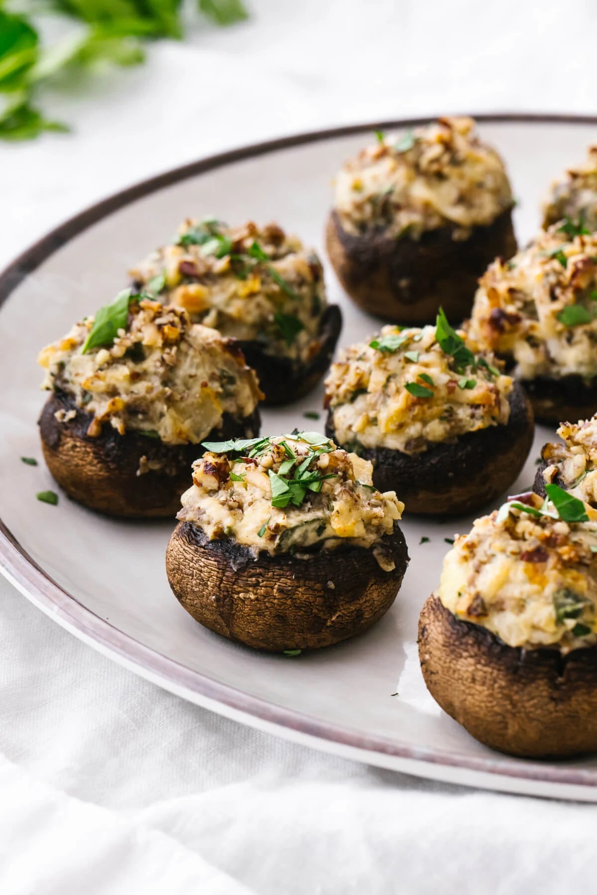 Stuffed mushrooms on a white plate.