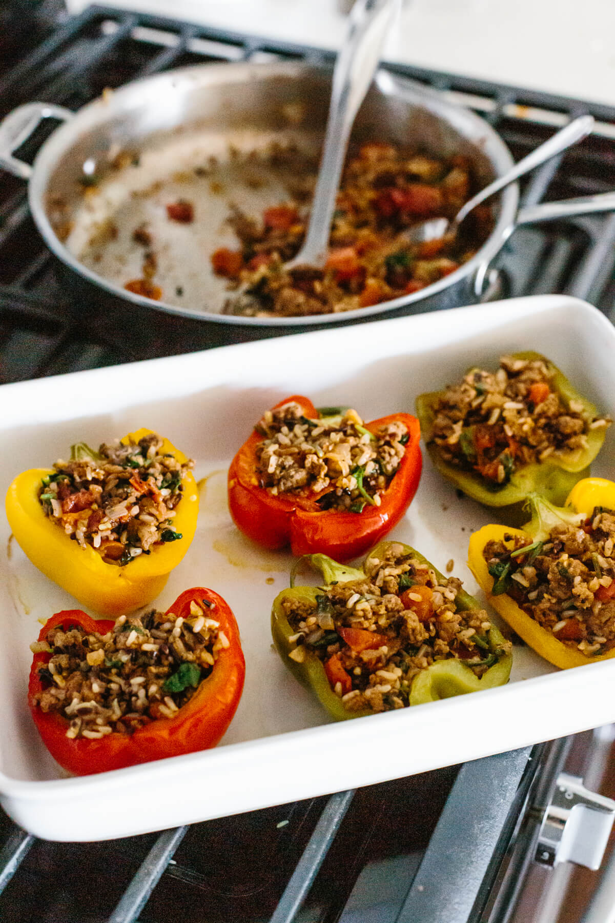 Filling the peppers with the stuffing.