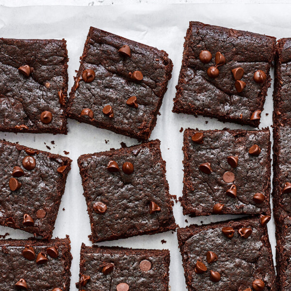 Sliced sweet potato brownies on parchment paper