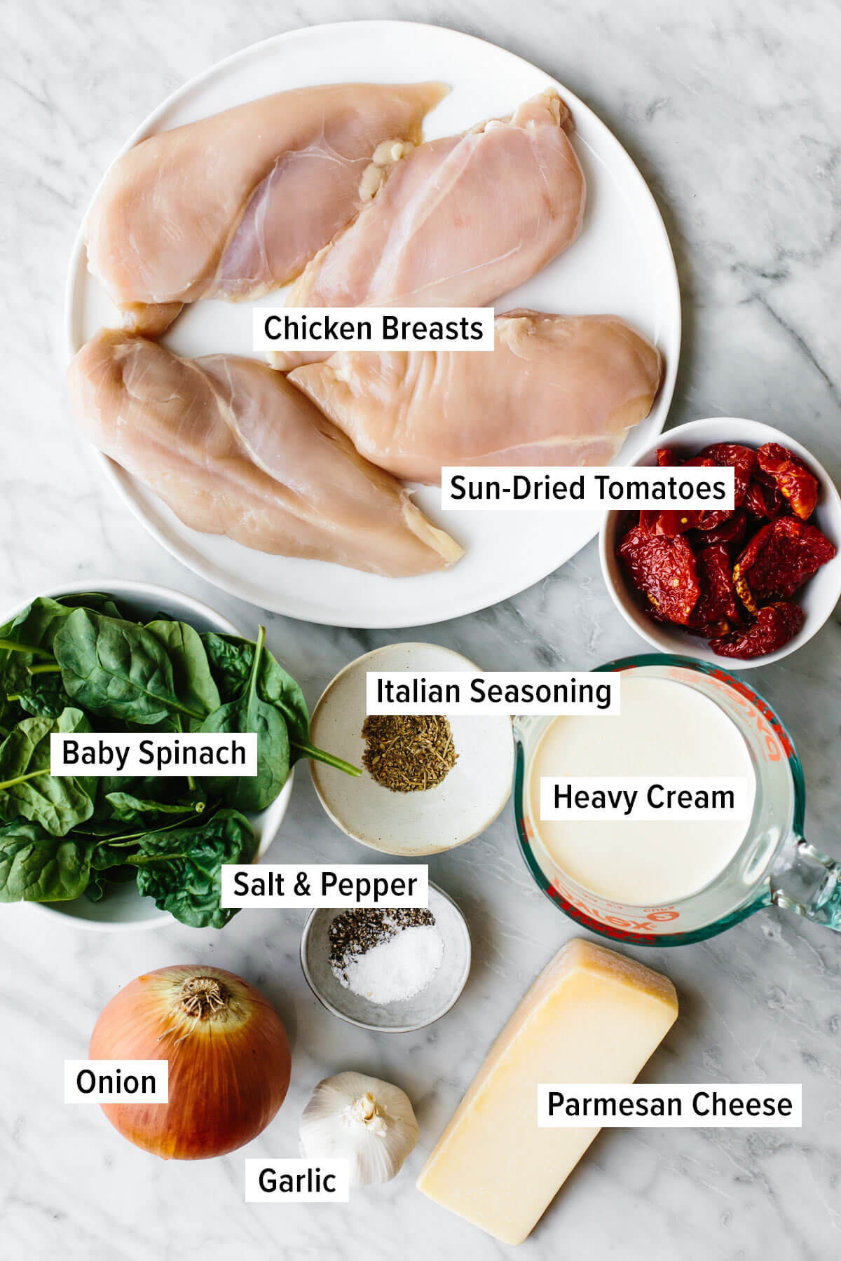 Ingredients for tuscan chicken on a table